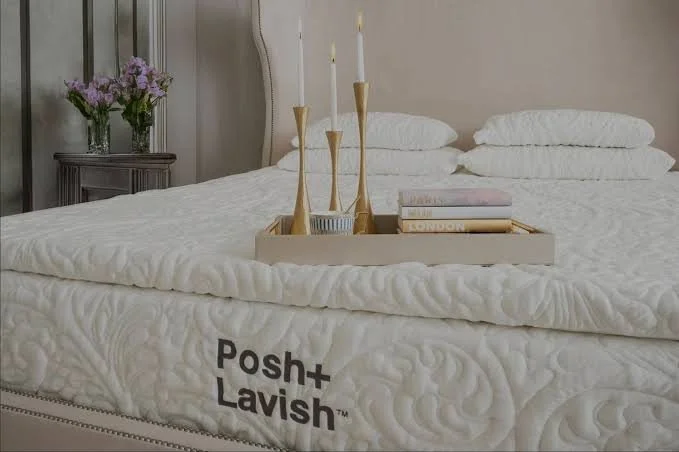 Posh+Lavish mattress with a gold tray of candles in a bright bedroom