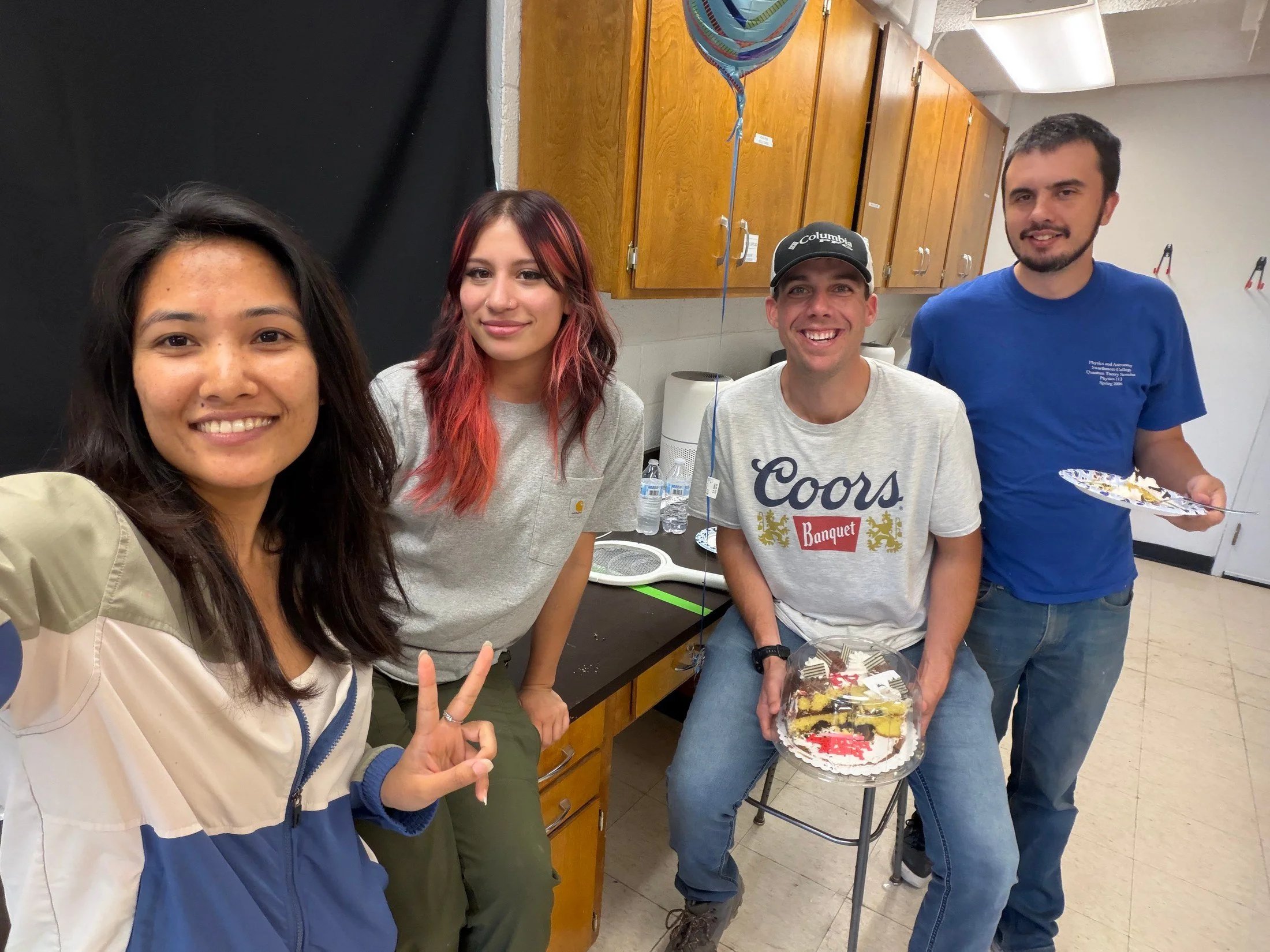Lab members gathered for Dr. Hubbard’s birthday, with a cake and birthday balloon.