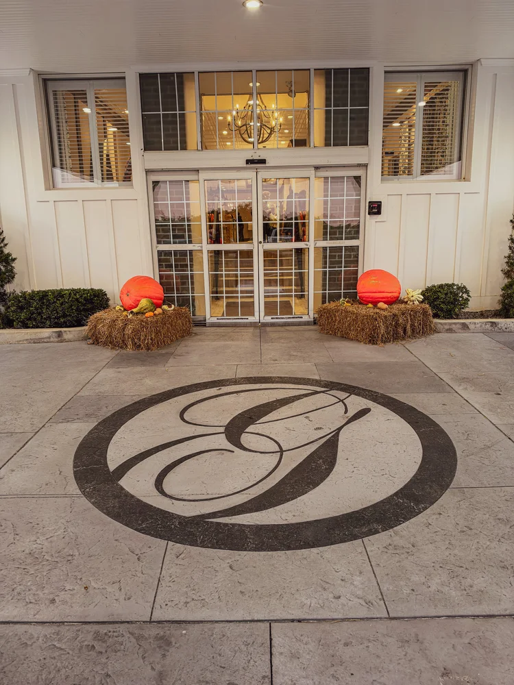 Stamped concrete entry with a custom monogram inlay