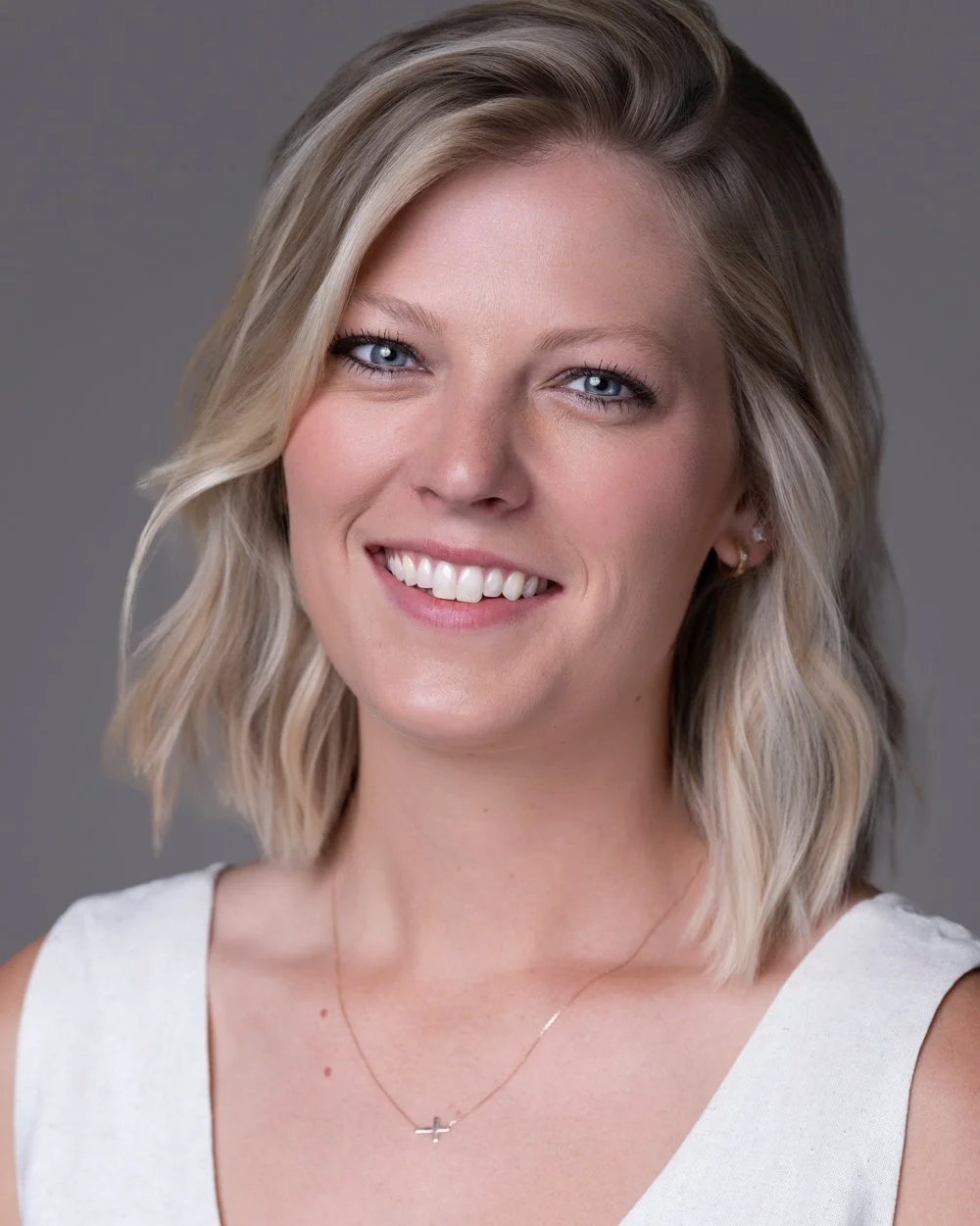 Studio portrait of a second team member, same setup.