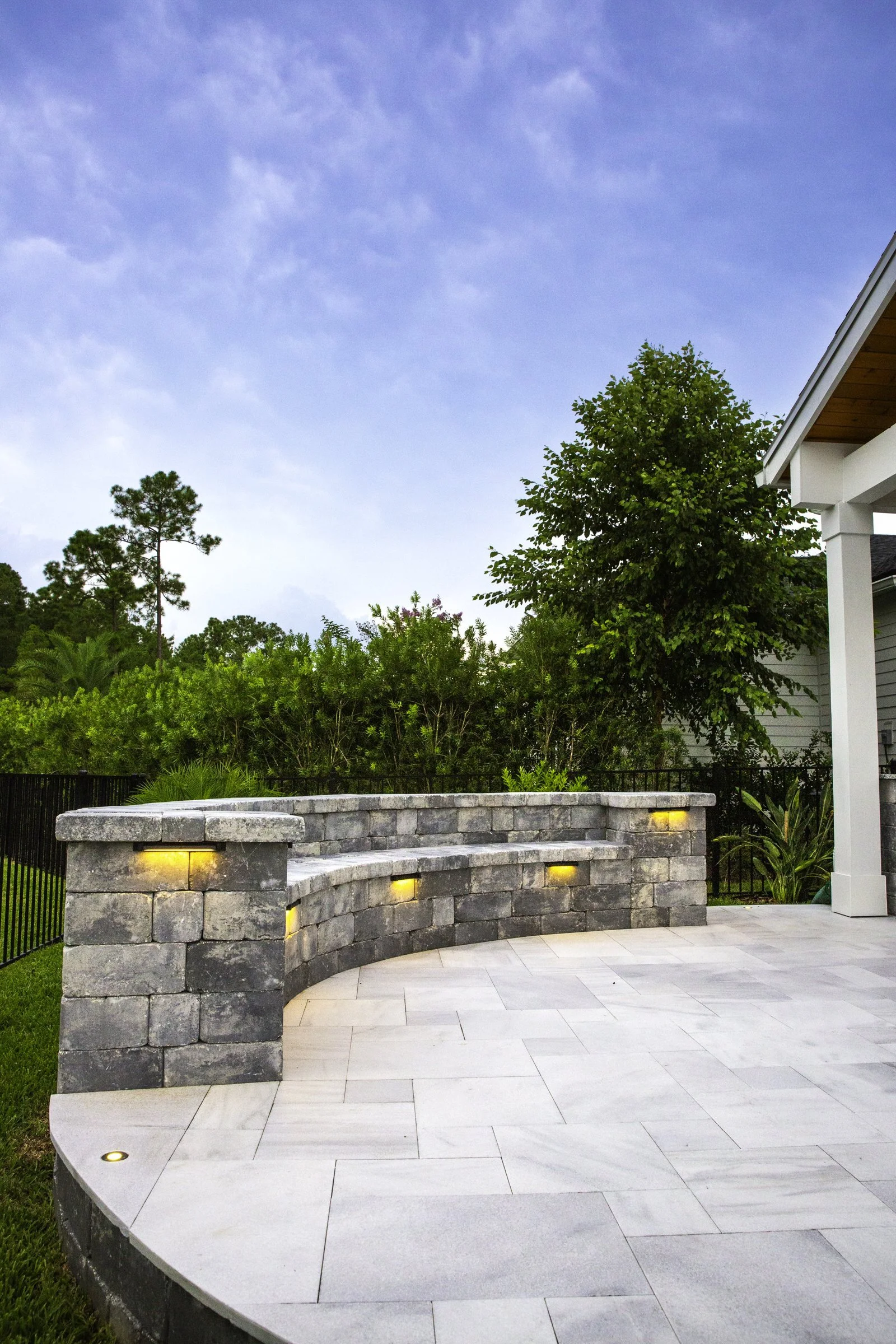 Curved seating wall with lighted caps in Seabrook, Nocatee
