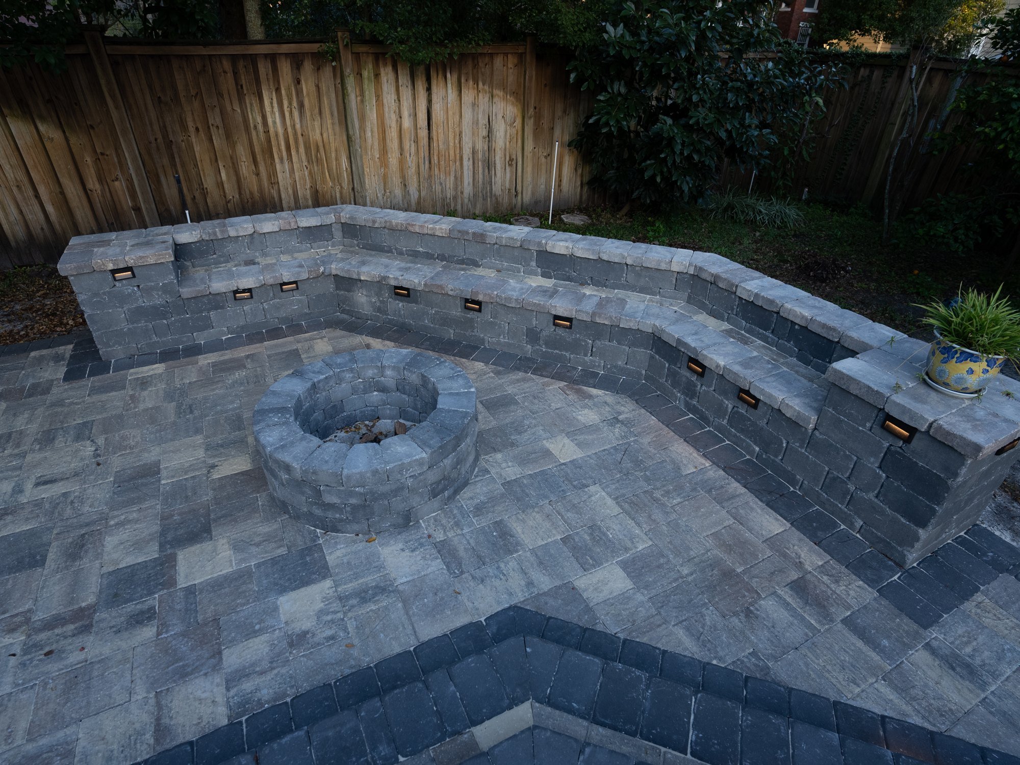 Bordered paver patio with a fire pit and seating wall in Riverside, Jacksonville