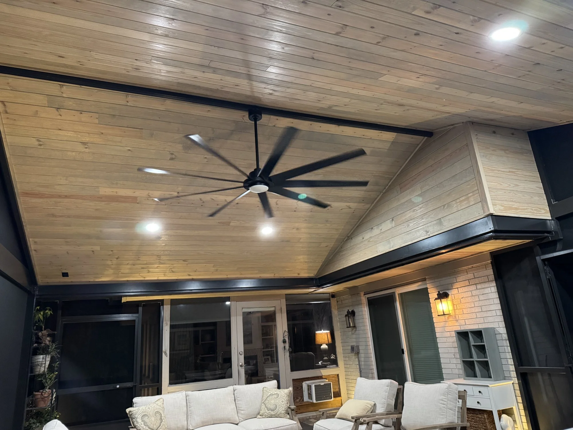 Ceiling fan under an A-frame wood ceiling in a screen room in Mandarin, Jacksonville