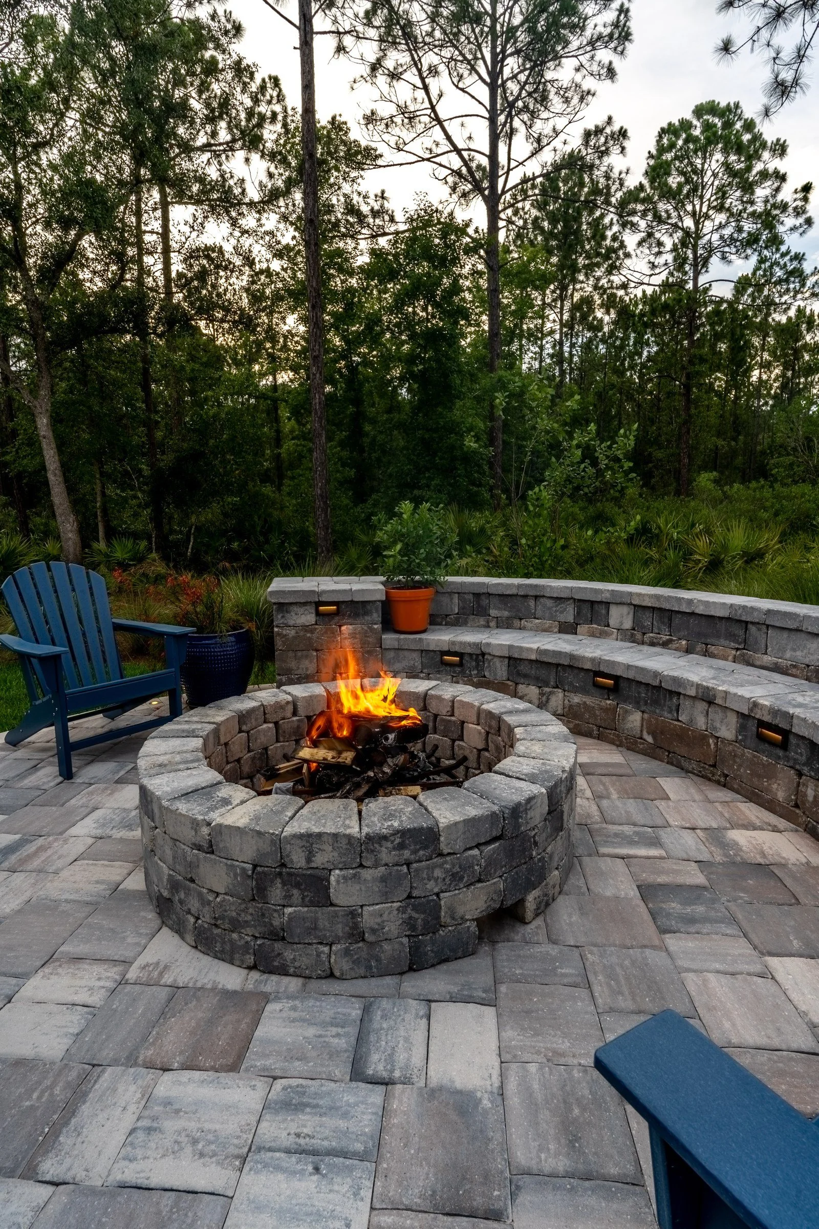 Wood-burning fire pit with a seating wall in RiverTown, St. Johns