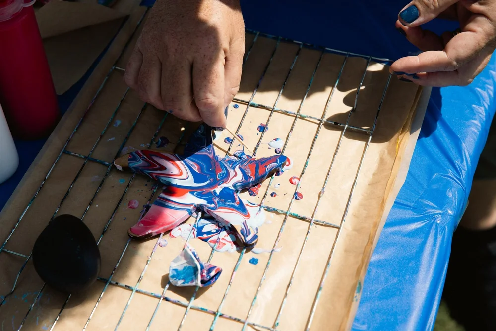 Painting a starfish at the craft table
