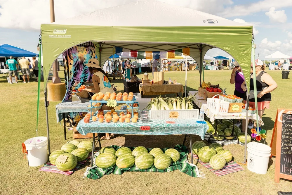 Farm stand with watermelons and produce