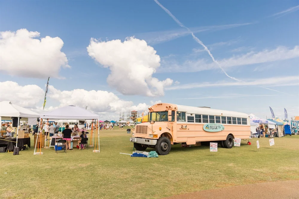 A vintage school bus under summer skies