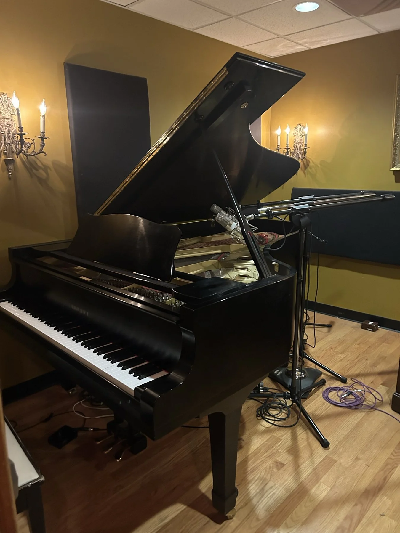 A grand piano ready for a recording session