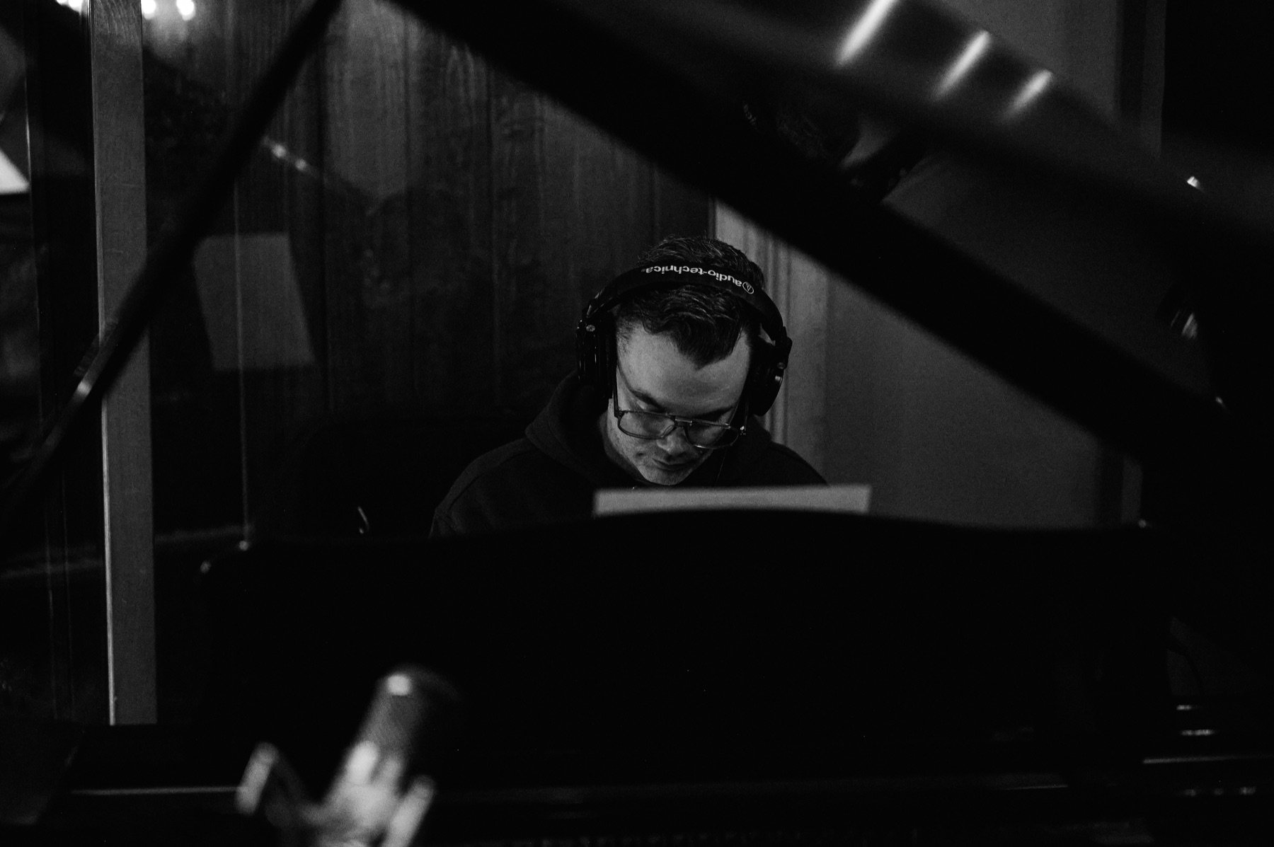 A musician playing keys in the recording studio