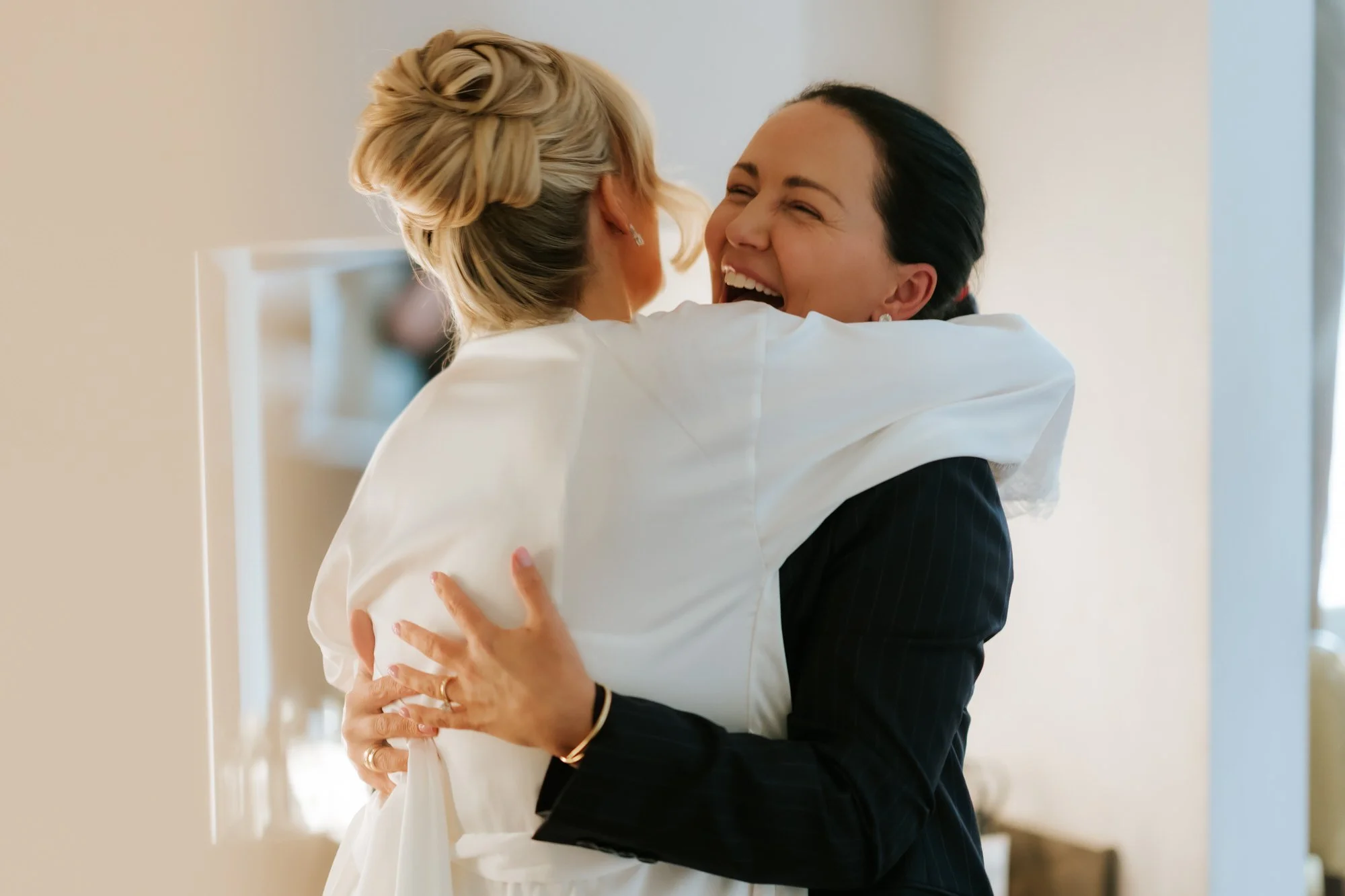 Nicole sharing a joyful hug before getting dressed.