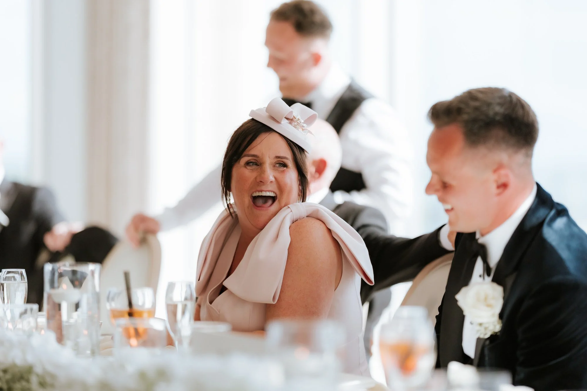 Laughter shared at the top table during the wedding speeches.