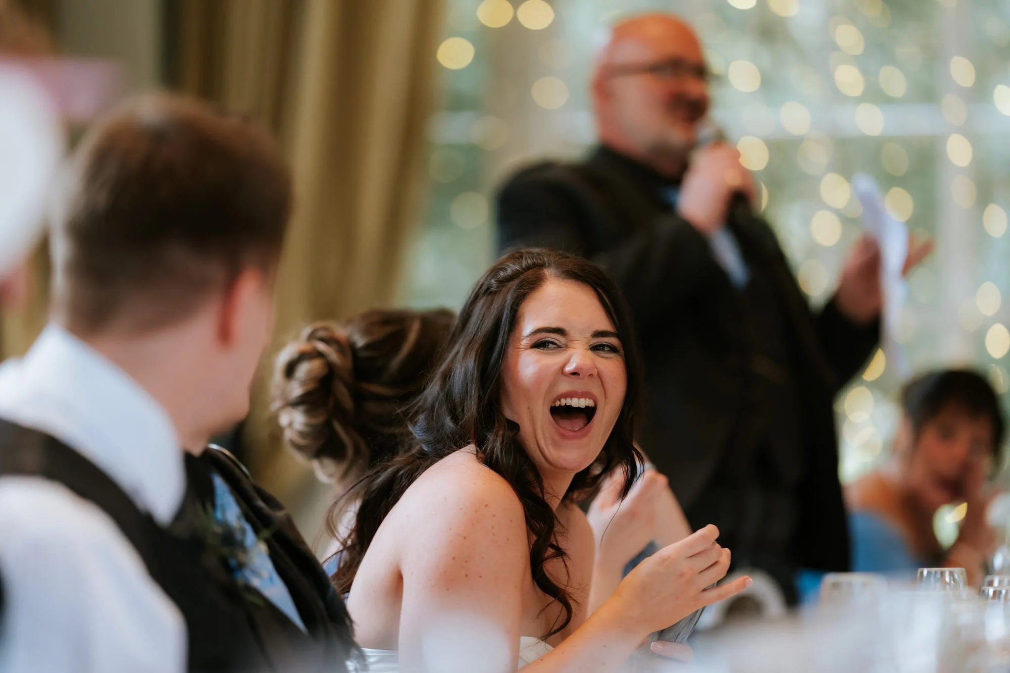 Steph laughing during the wedding speeches.