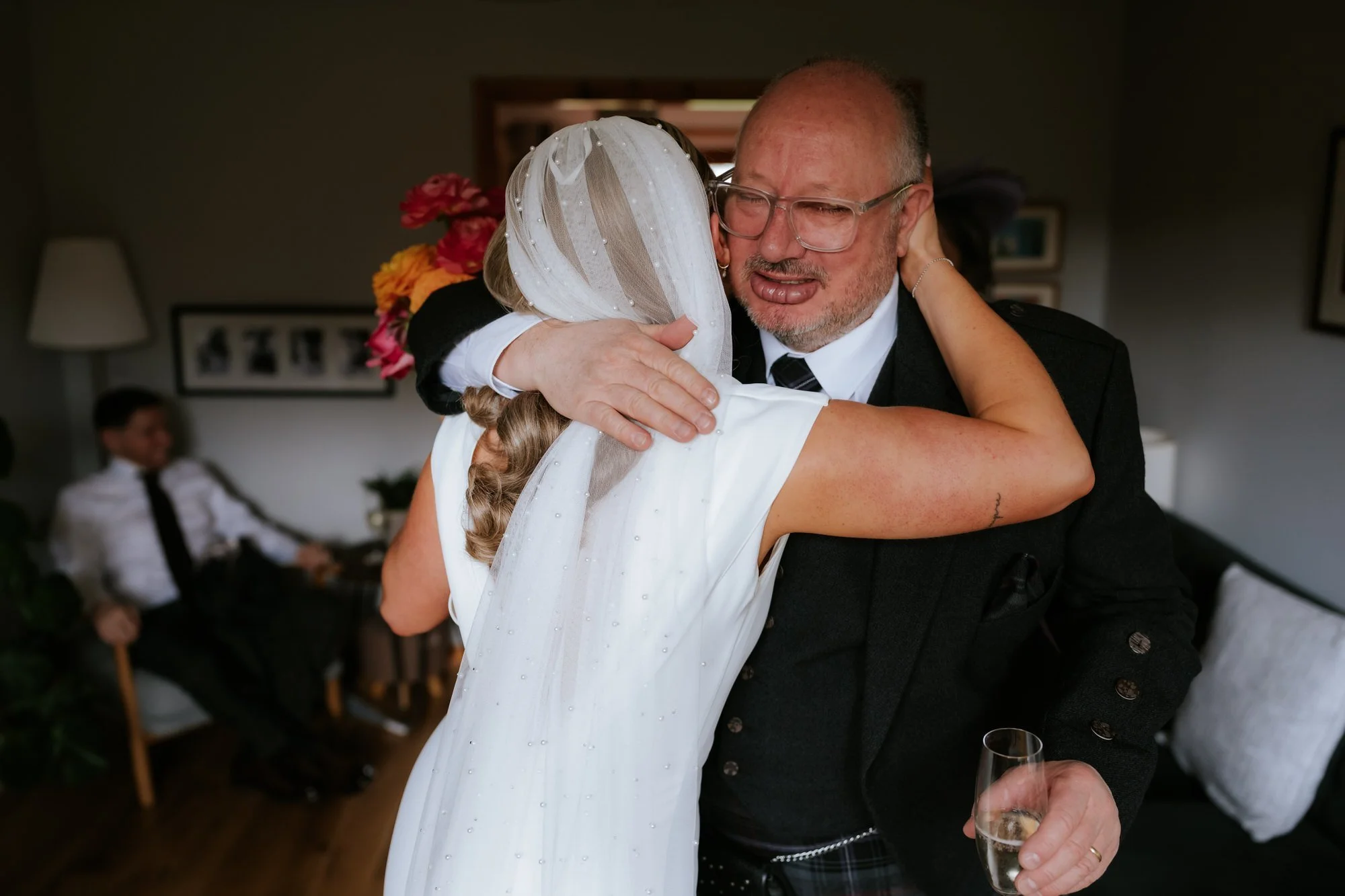 Rhona sharing a hug with her dad before the ceremony.