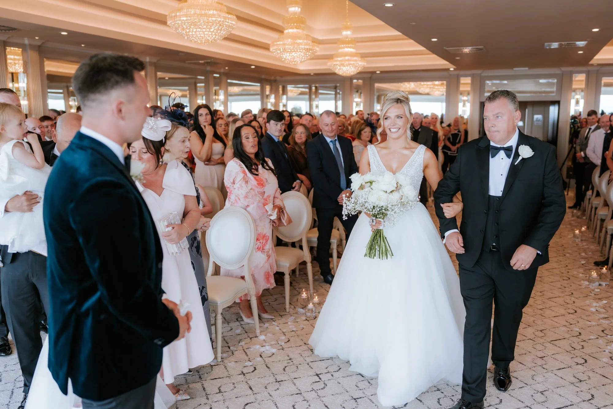 Nicole walking down the aisle with her dad.