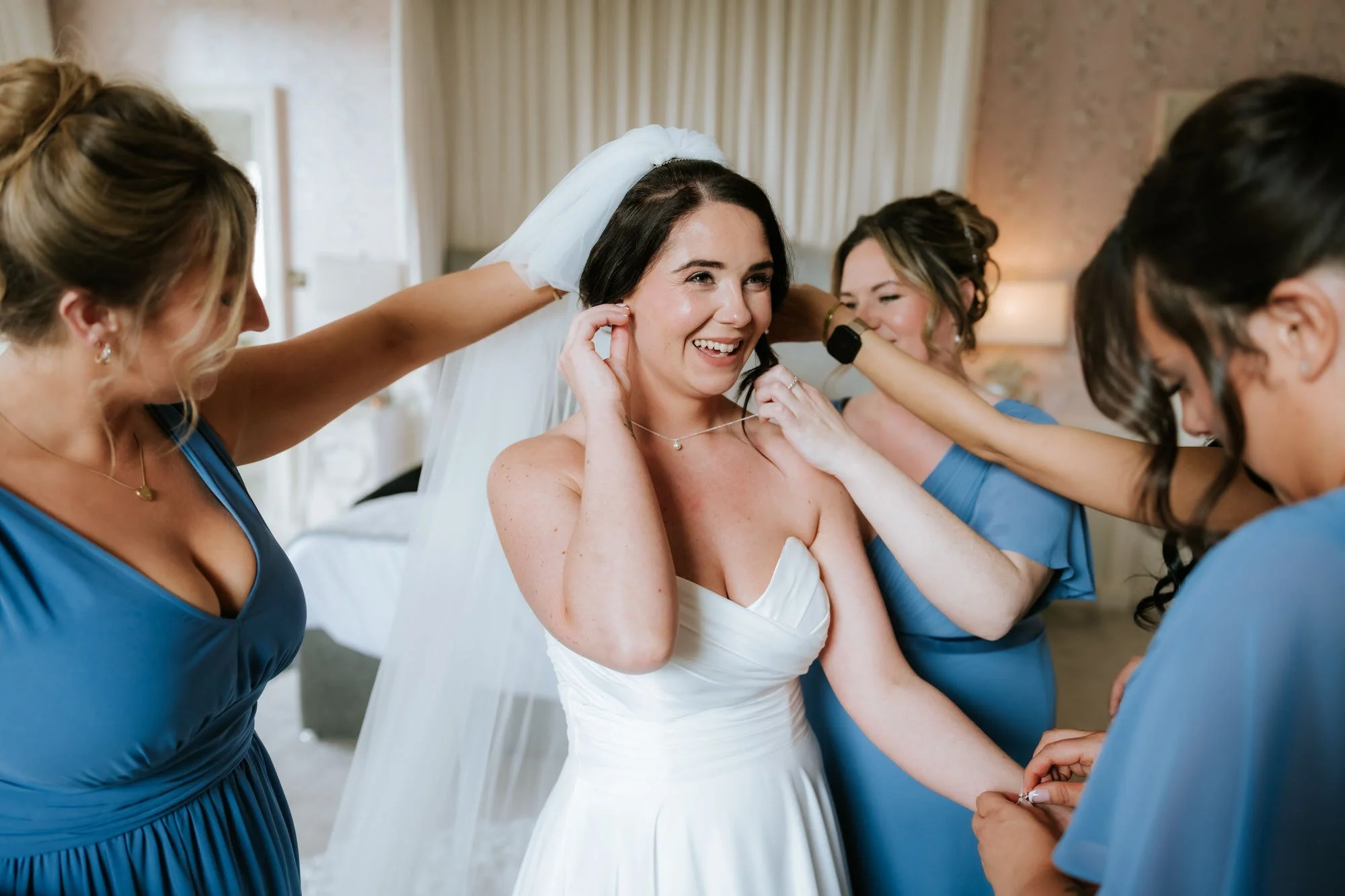 Steph and a bridesmaid sharing a moment during preparations.