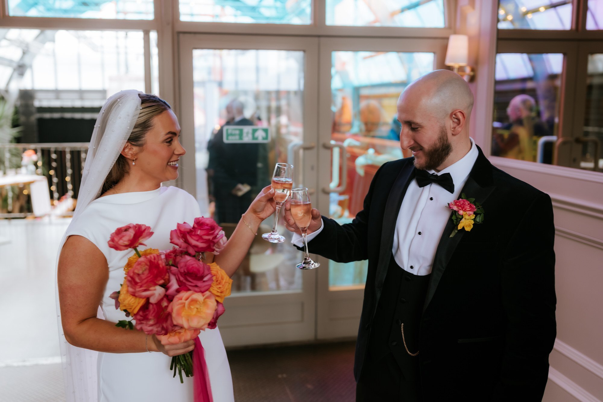 Rhona and Ciaran raising a champagne toast.
