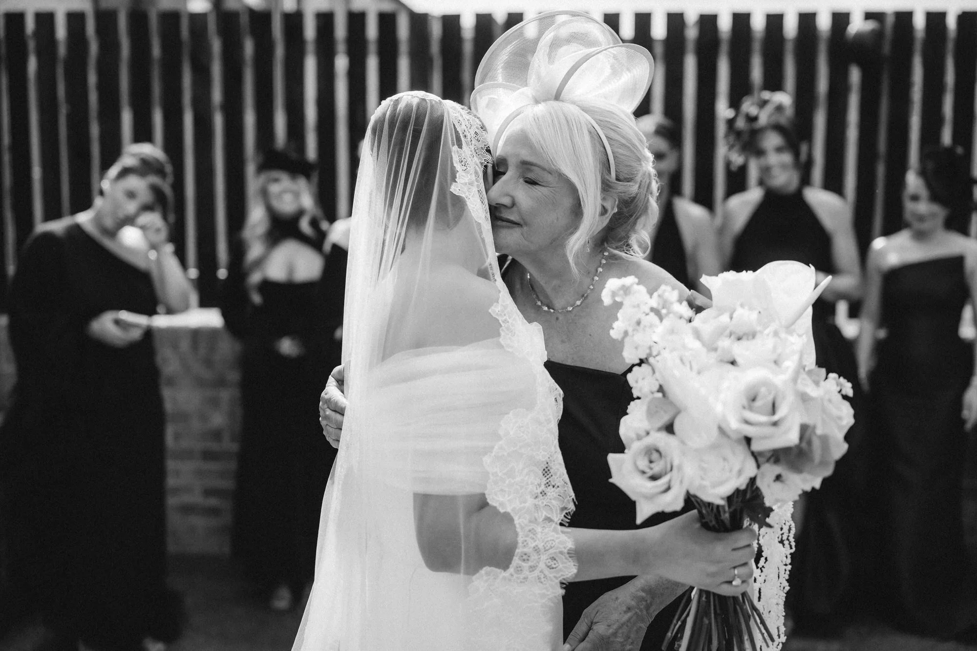 Caitlin sharing an emotional hug outside before her wedding.