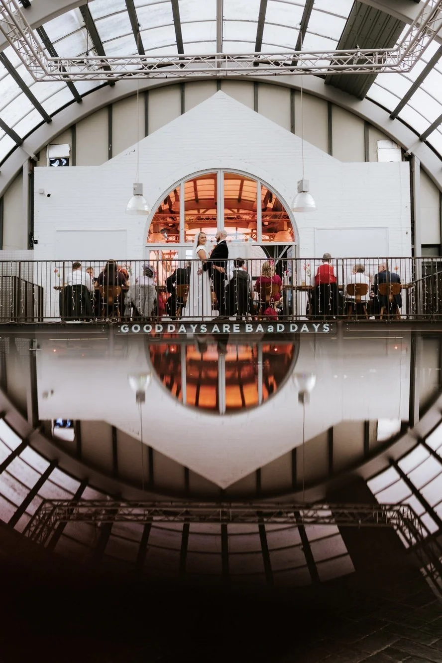 Rhona and Ciaran beneath the glass roof and mezzanine at BAaD Glasgow.