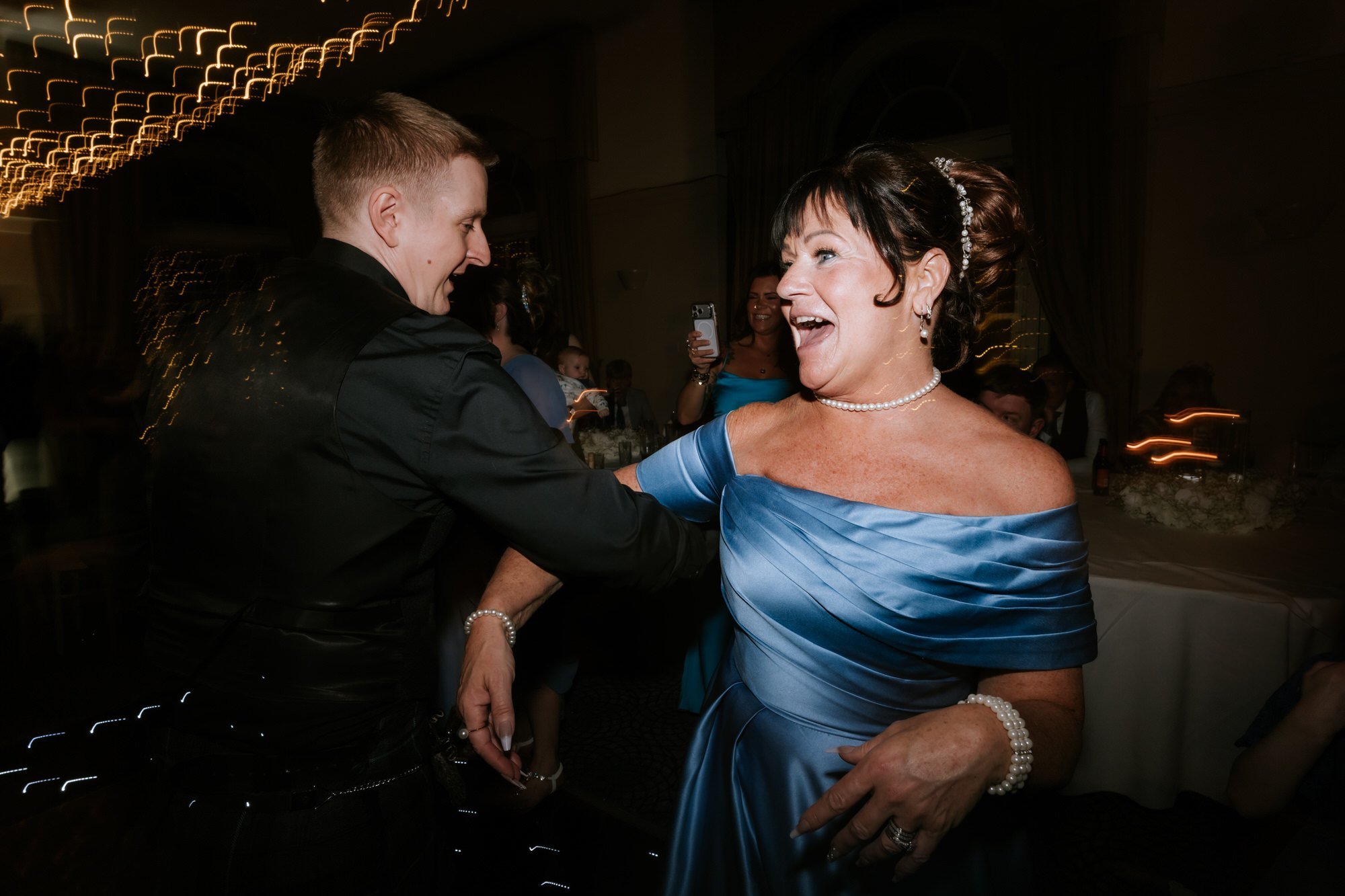 Calum sharing a family dance at the wedding reception.