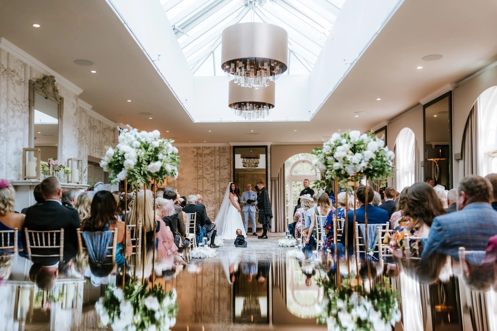 A wide view of Steph and Calum's light-filled wedding ceremony.