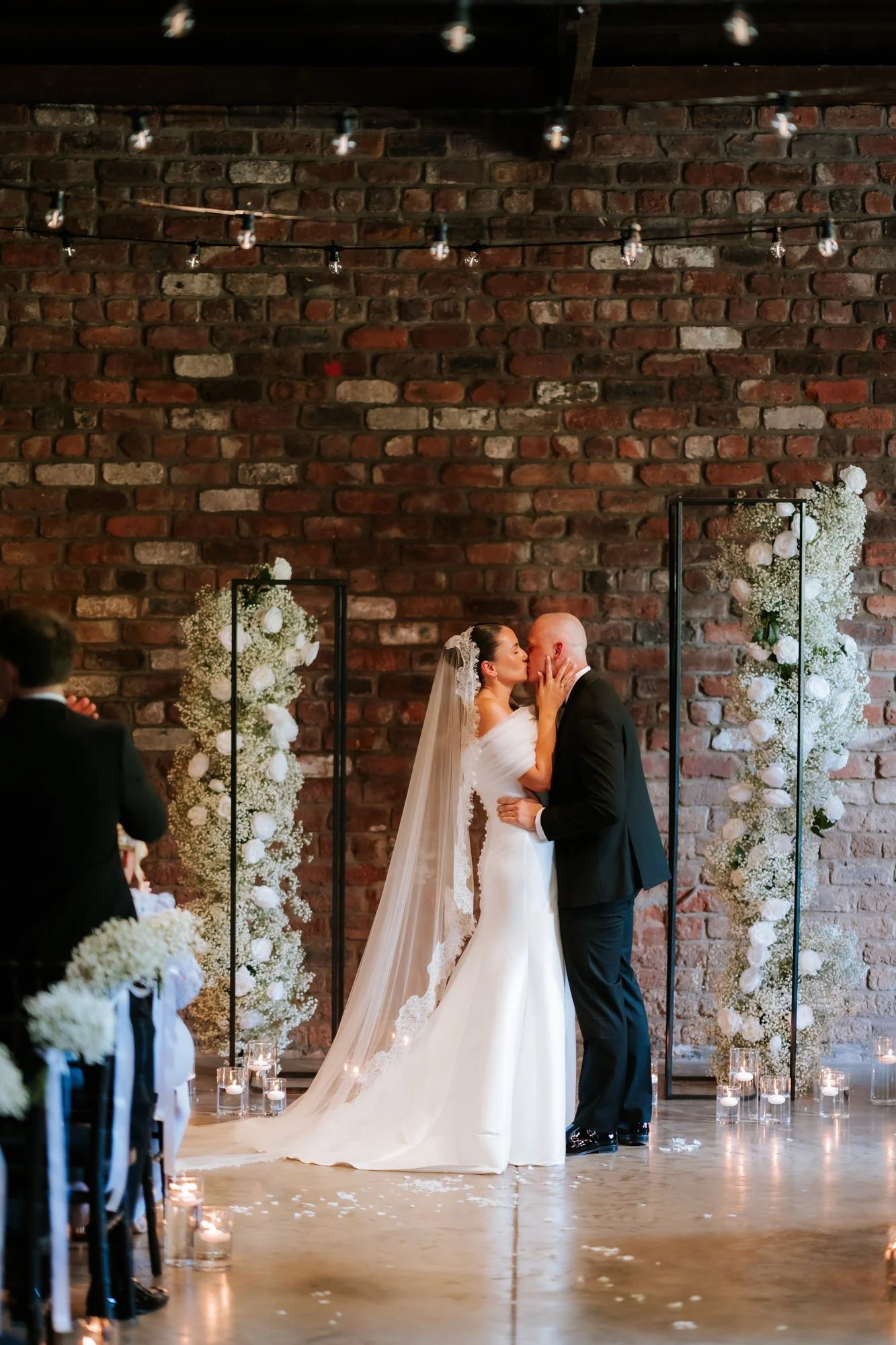 Caitlin and Craig sharing their first kiss during the ceremony.