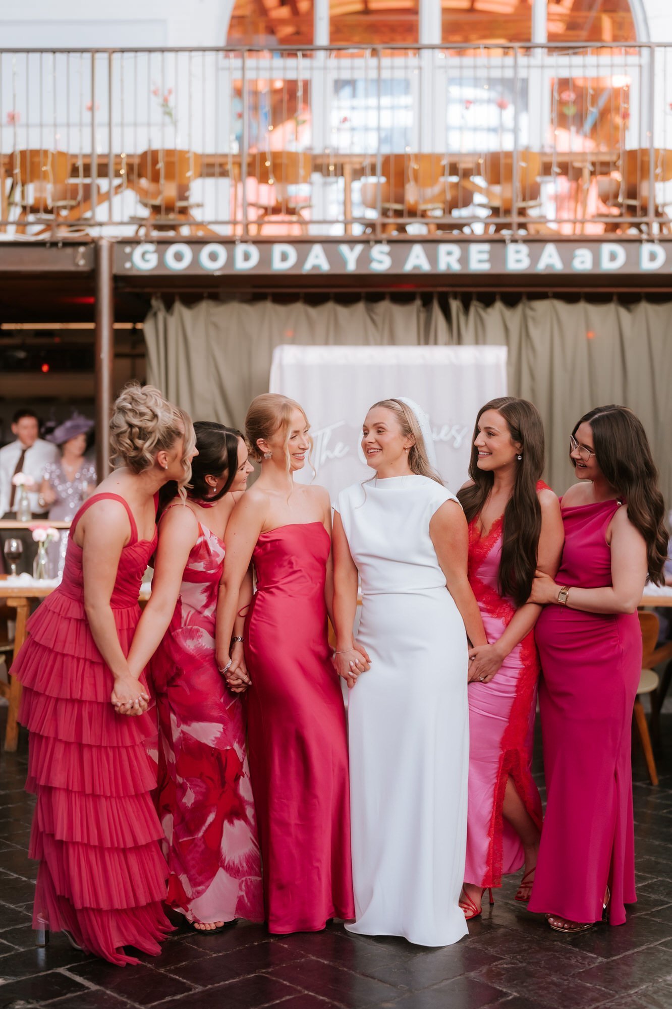 Rhona with her bridesmaids in pink dresses.