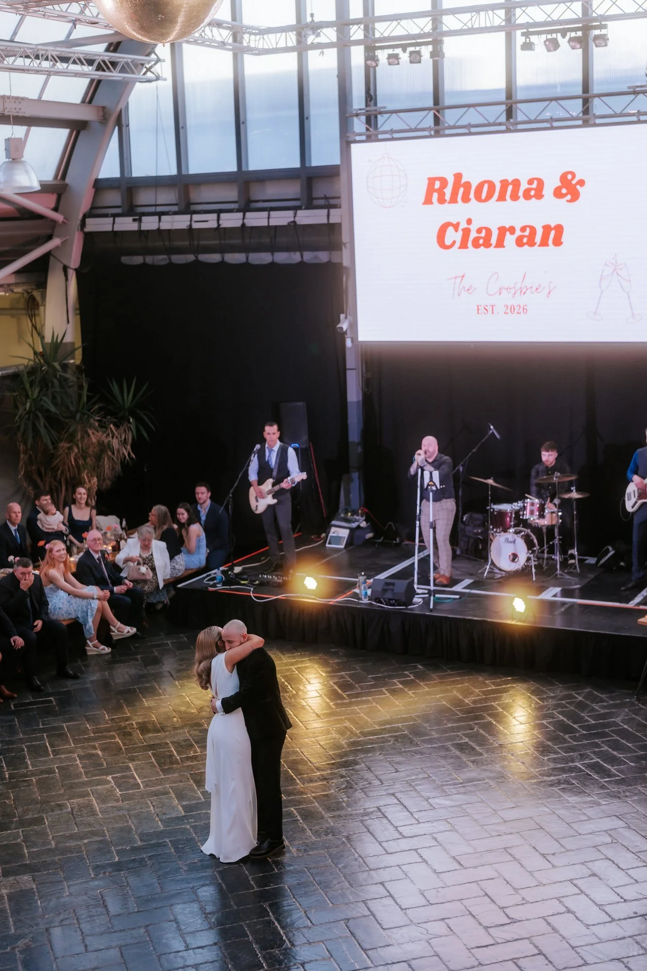 An elevated view of the first dance with the band on stage.