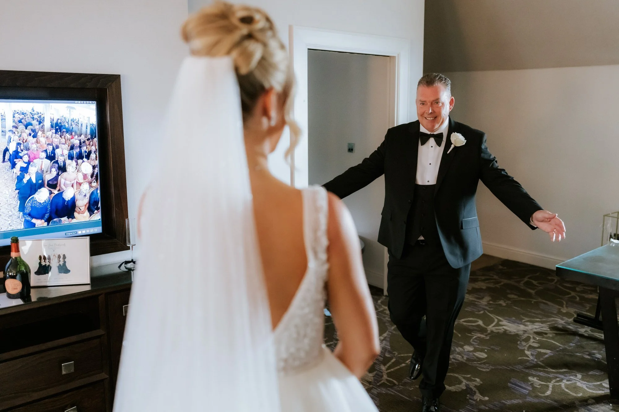 Nicole's dad seeing her in her wedding dress for the first time.