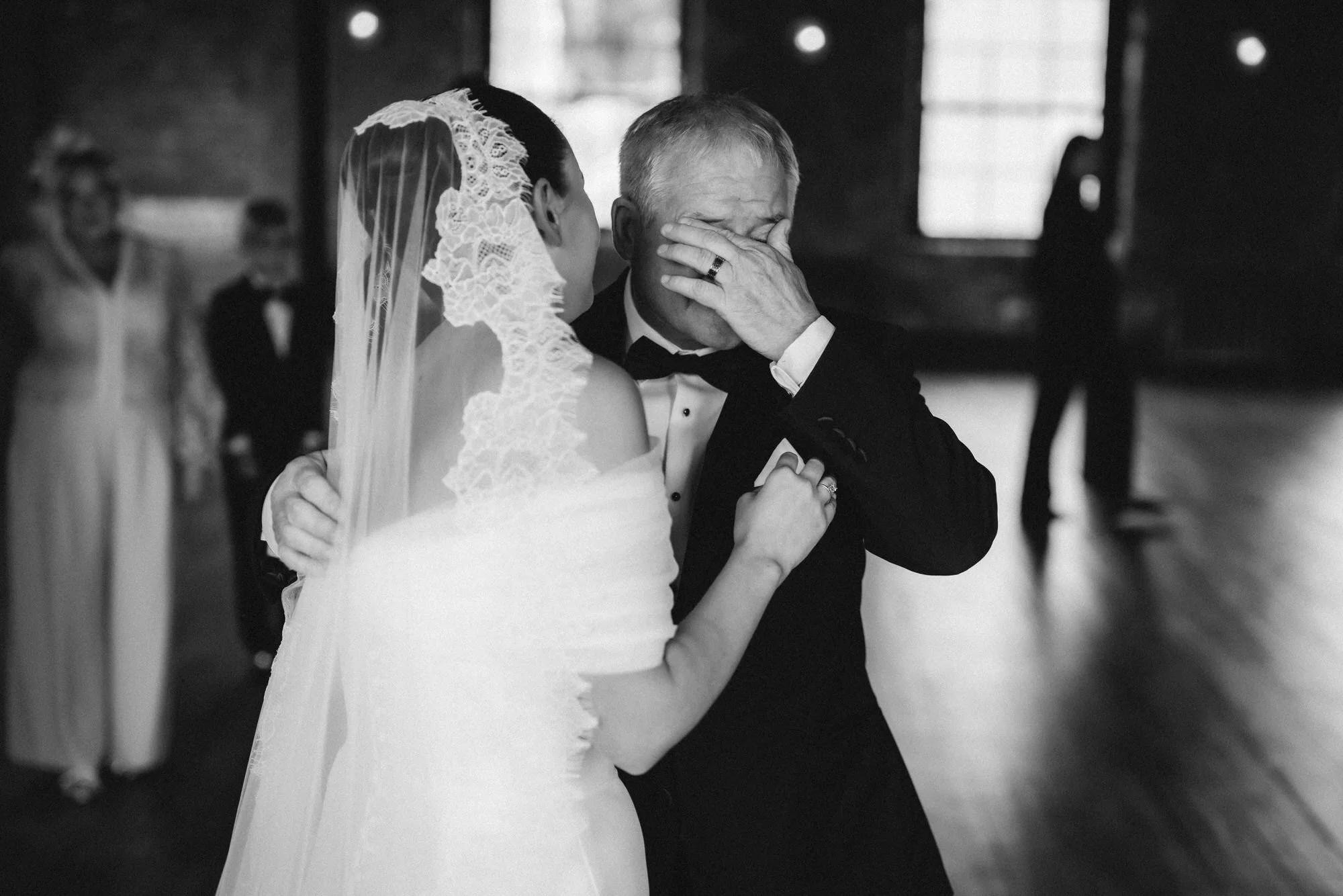 Caitlin sharing a close family embrace before the ceremony.