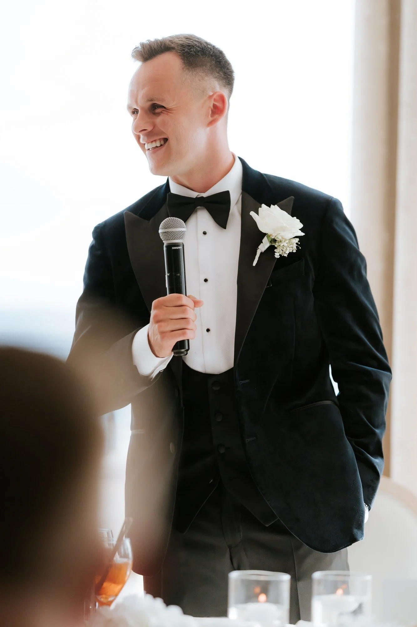 Lawrence Shankland smiling while giving his wedding speech.