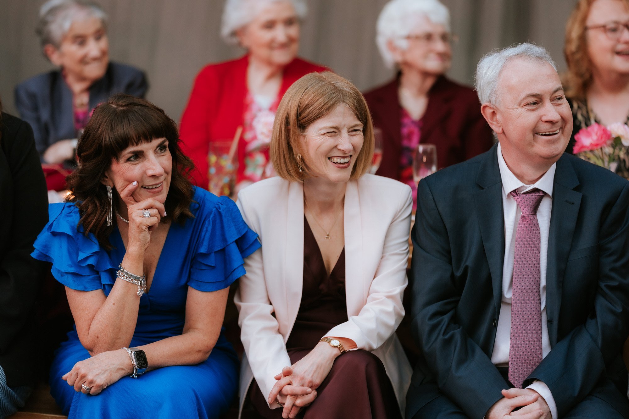A guest laughing during the evening celebrations.