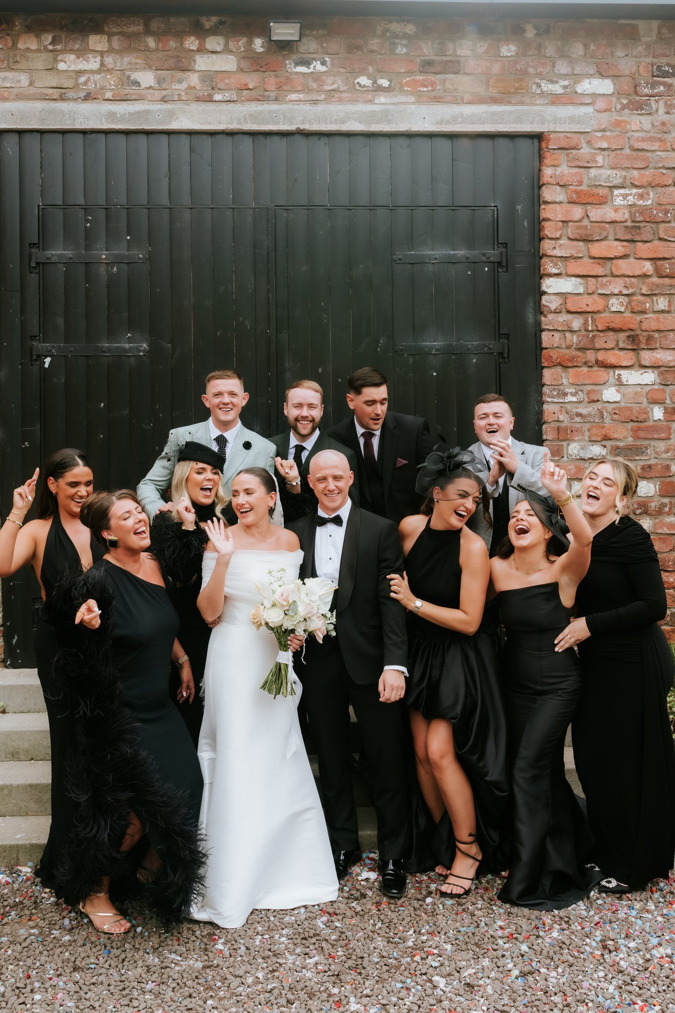 Caitlin and Craig celebrating with friends in the courtyard at The Engine Works.