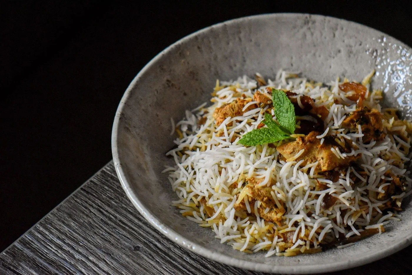 Biryani in a speckled bowl