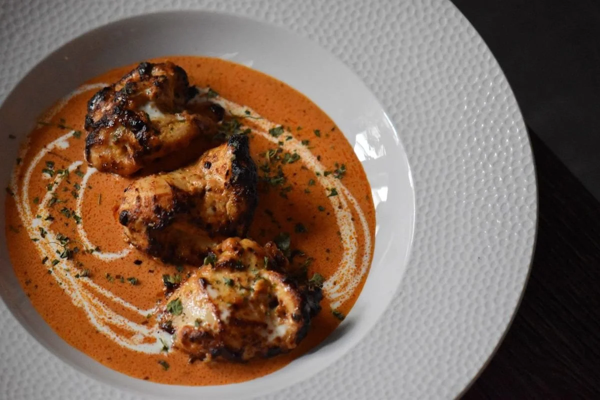Punjabi Butter Chicken with a swirl of cream