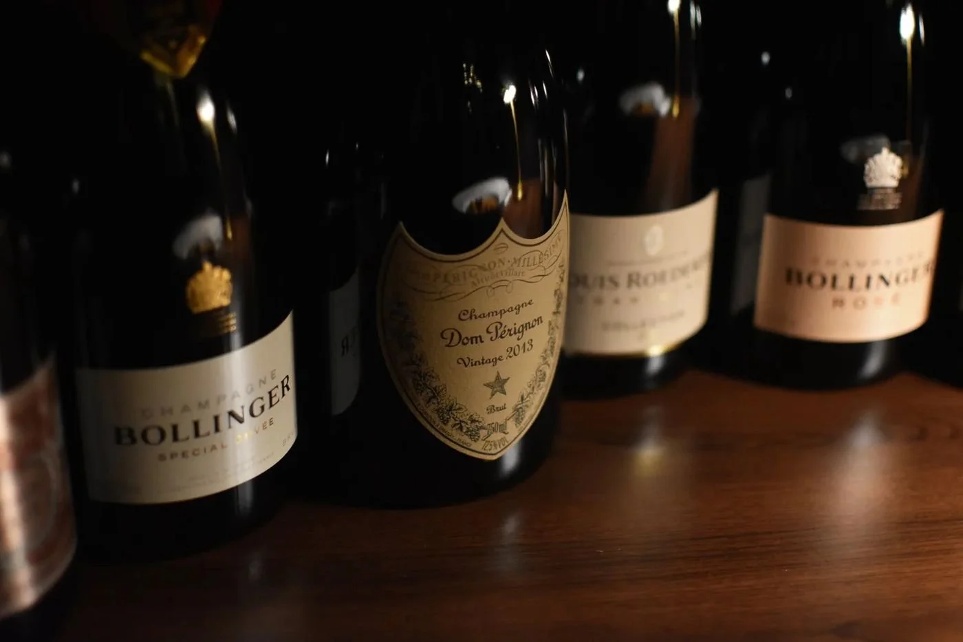 Bottles of Bollinger, Dom Perignon and other champagnes on the bar