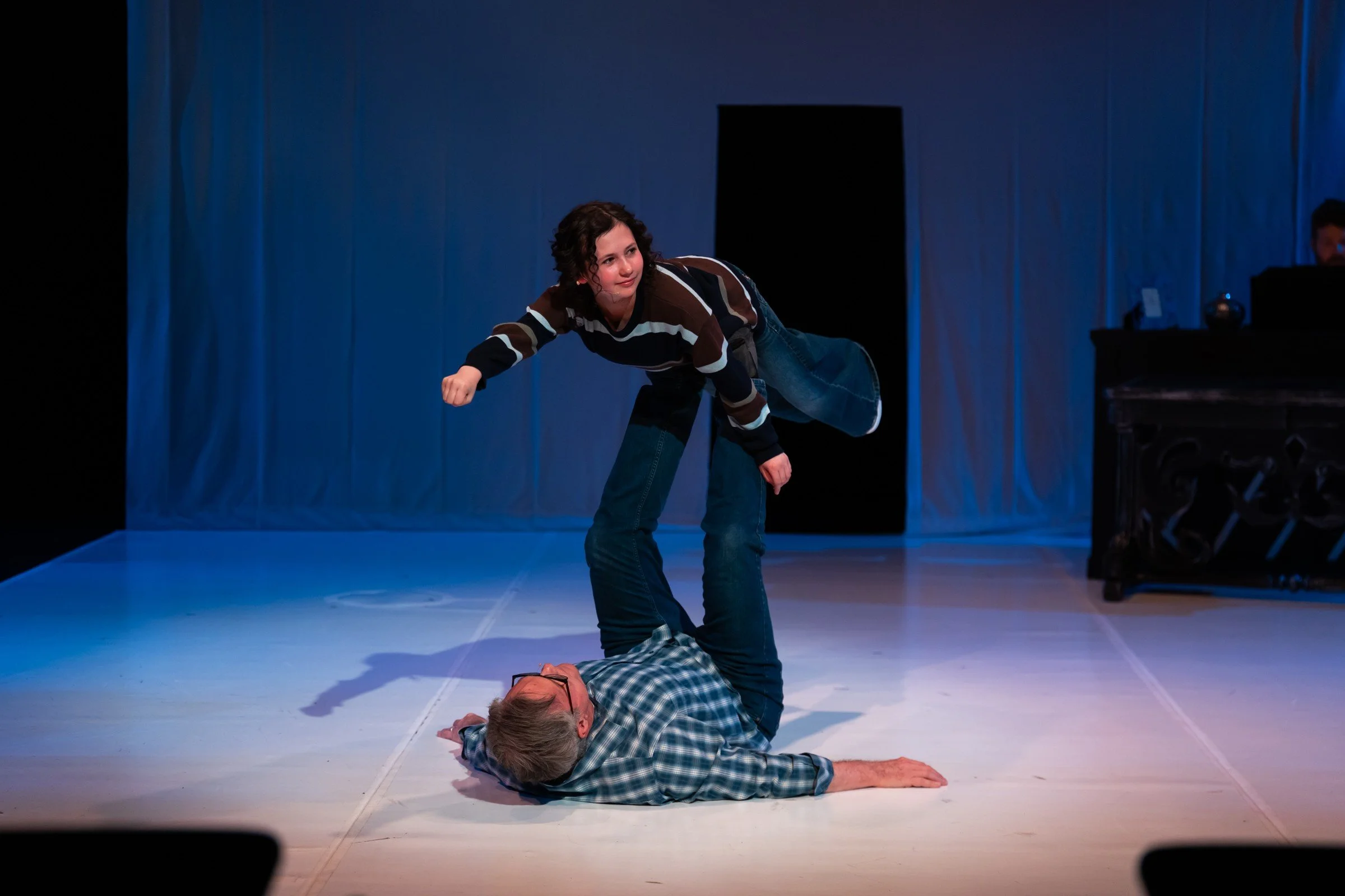 A childhood memory takes flight on the white stage of Fun Home.