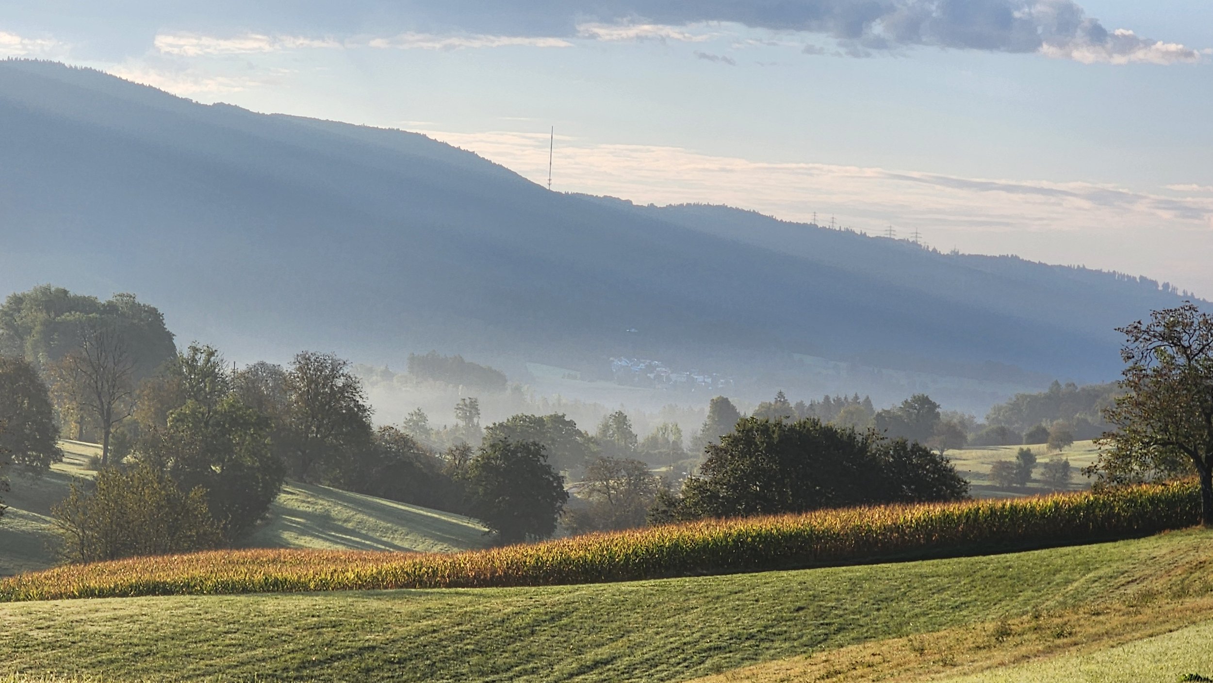 Mist over fields and hills in southern Germany