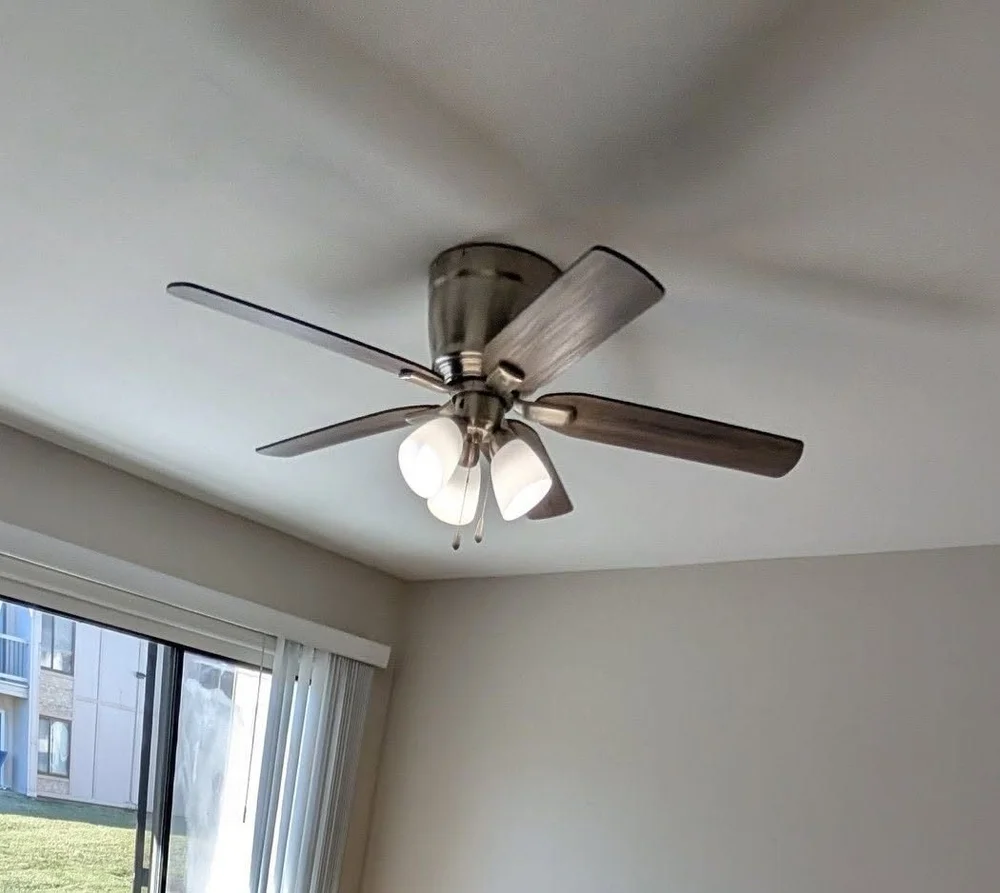 New ceiling fan with lights installed in a bedroom