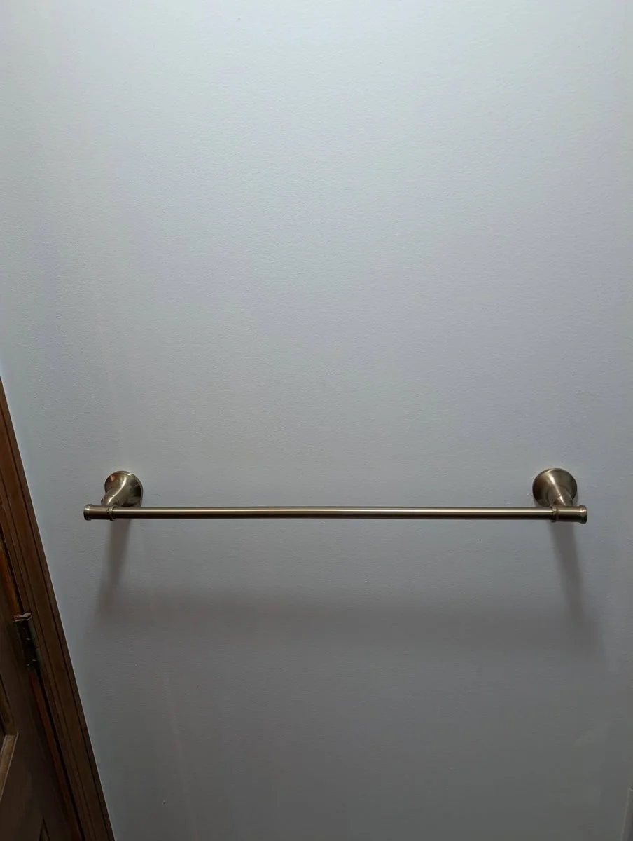 Grab bar installed on a bathroom wall for senior safety