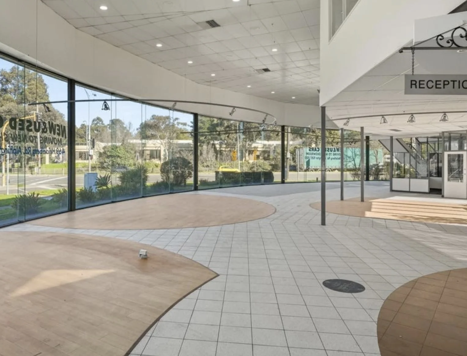 Interior of the main showroom with full-height glazing
