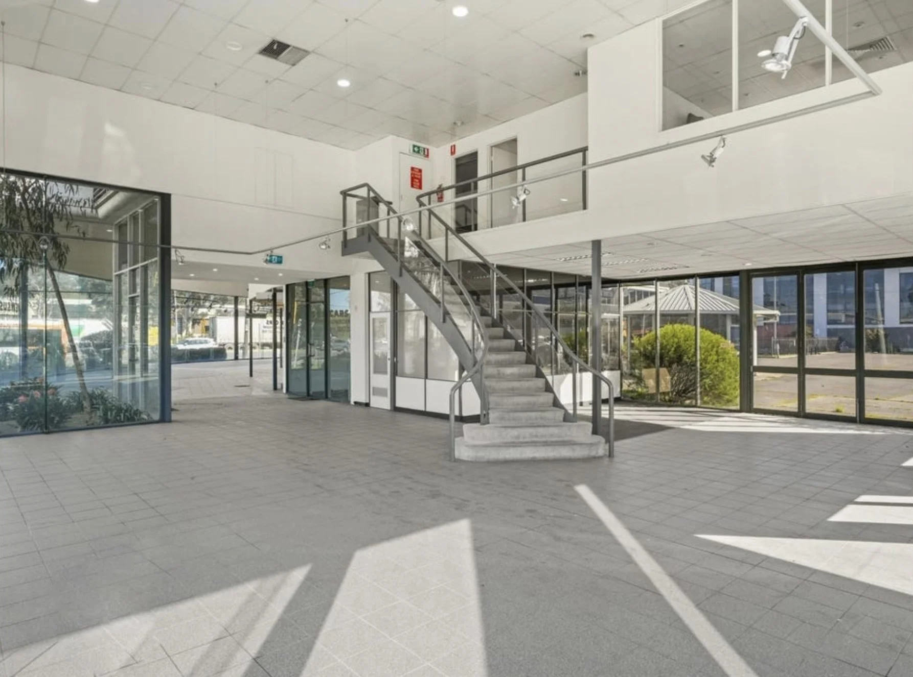 Showroom interior with stair to the mezzanine office