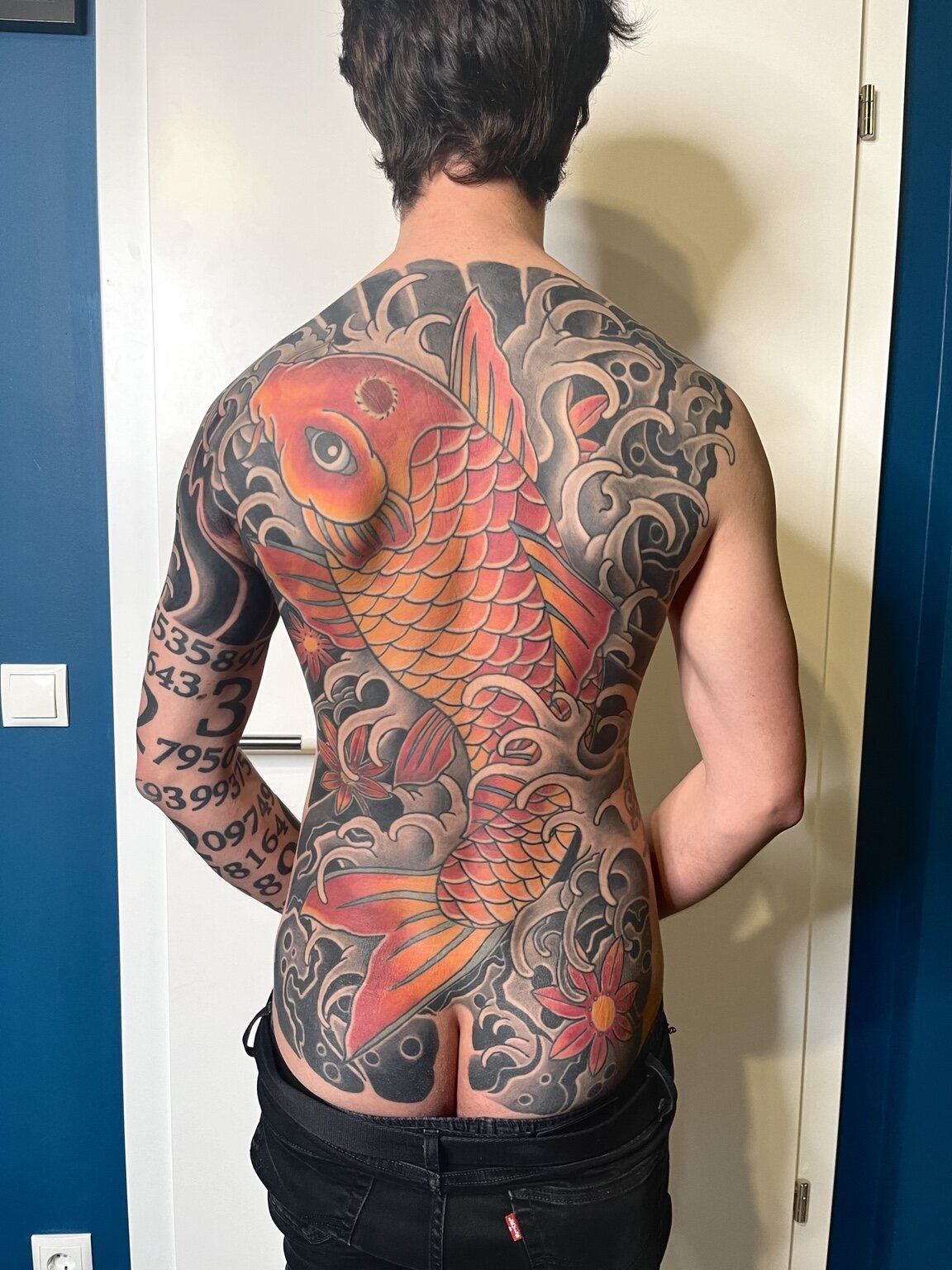 Large colour Japanese koi backpiece tattooed at Door Number Four in Vienna.