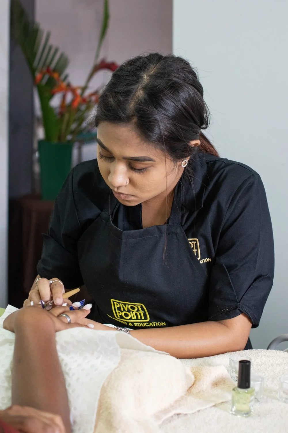 Cutting on a real client in the Pivot Point salon, 2019