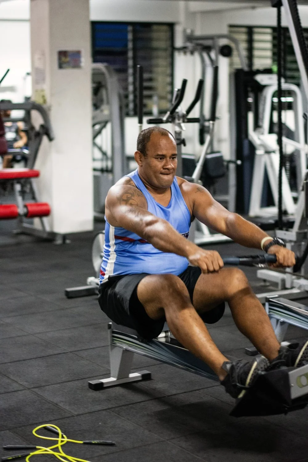 A student on the rowing machine during fitness training, 2019