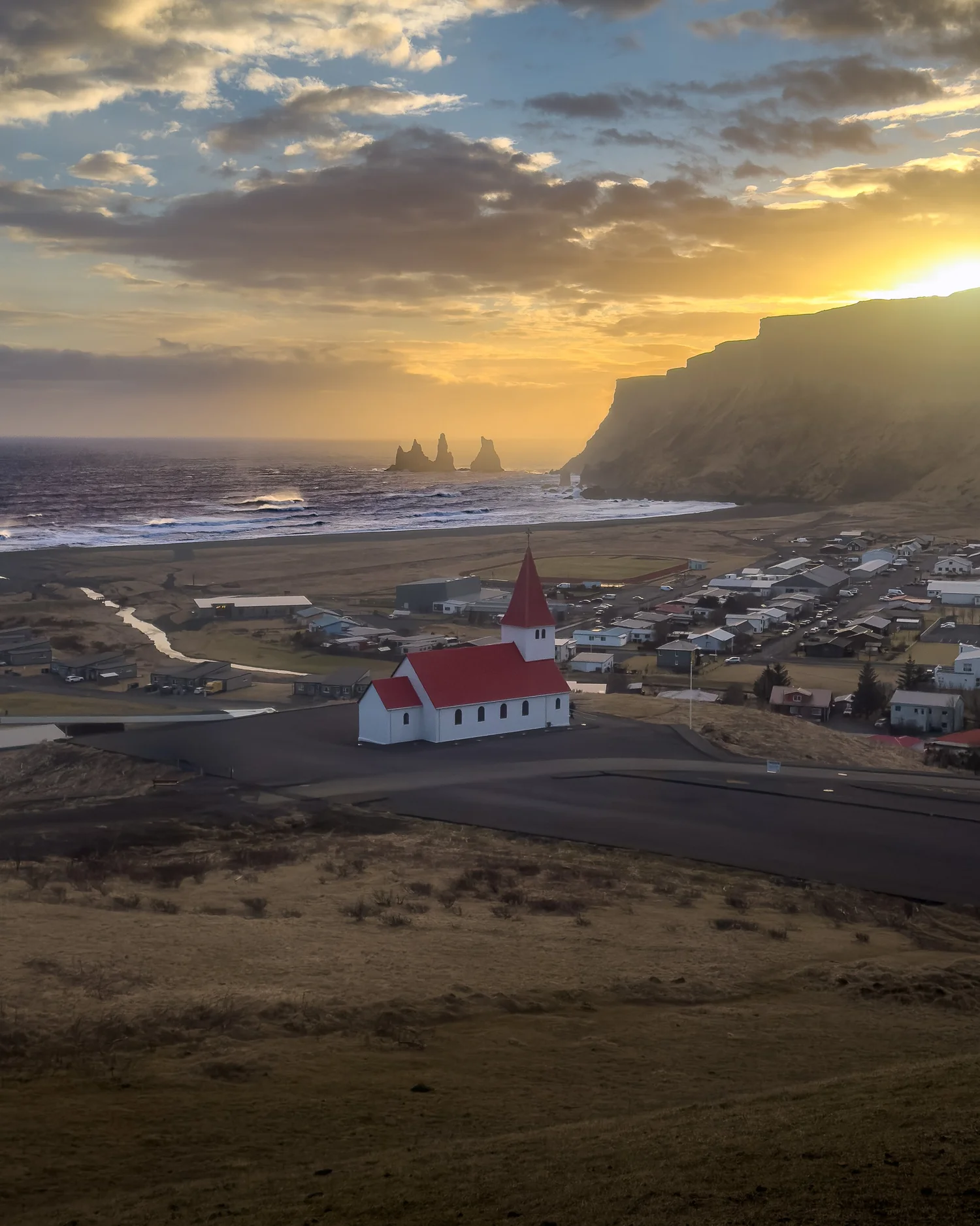 Vík village surrounded by the mountains and coastline of South Iceland