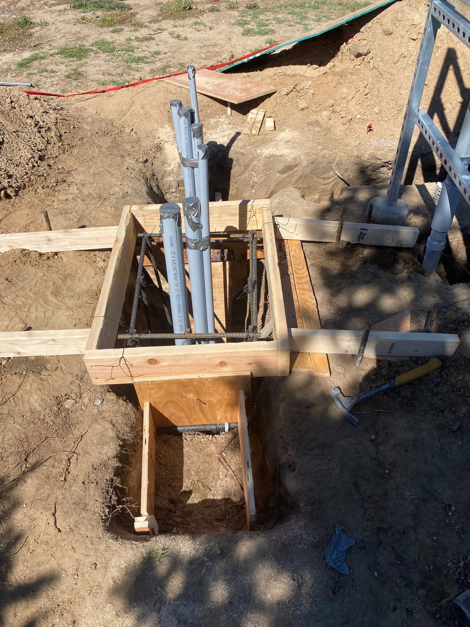 Light pole base formwork with rebar cage and conduit set before the pour