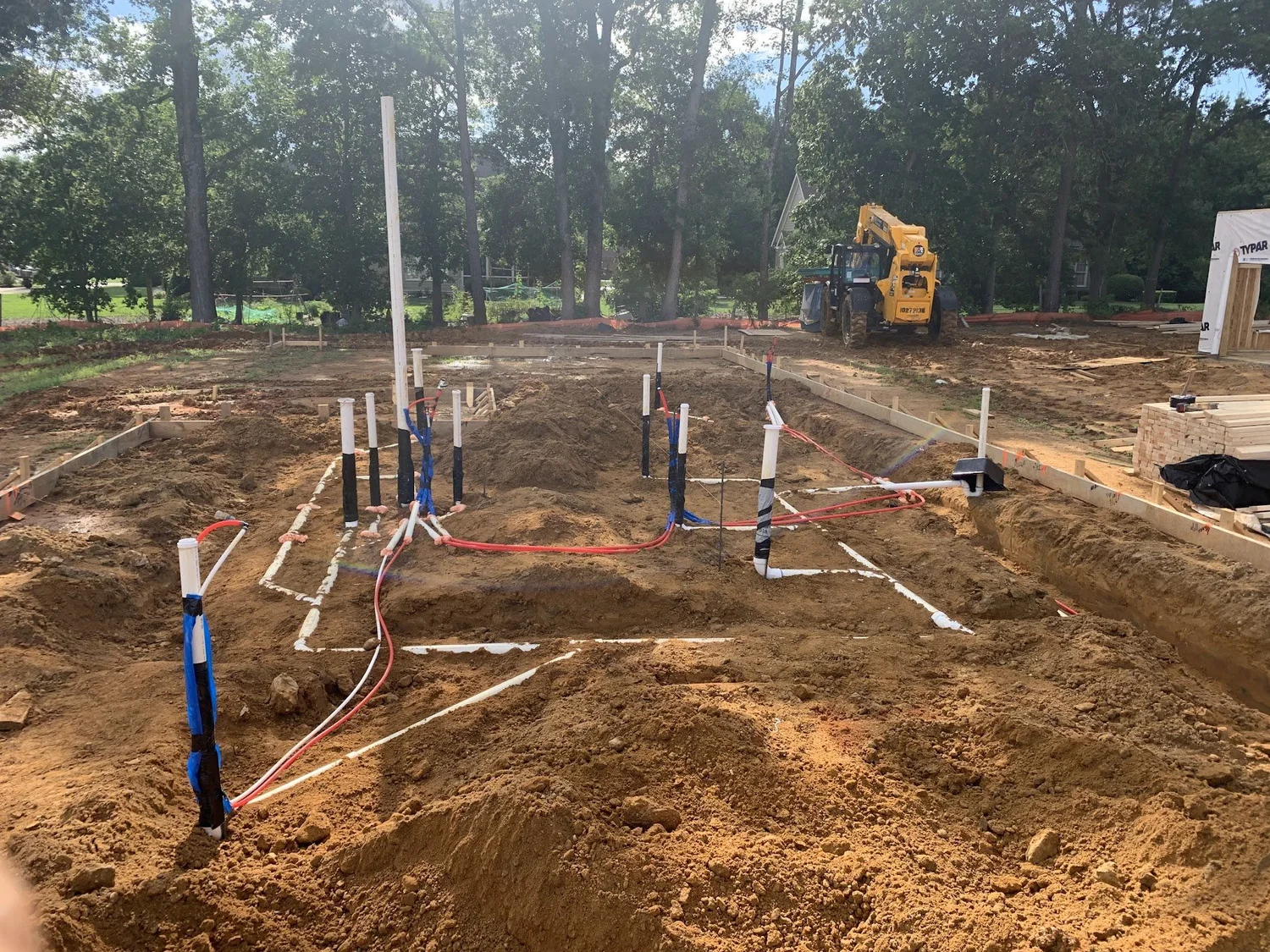 Under-slab plumbing rough-in on a new construction site