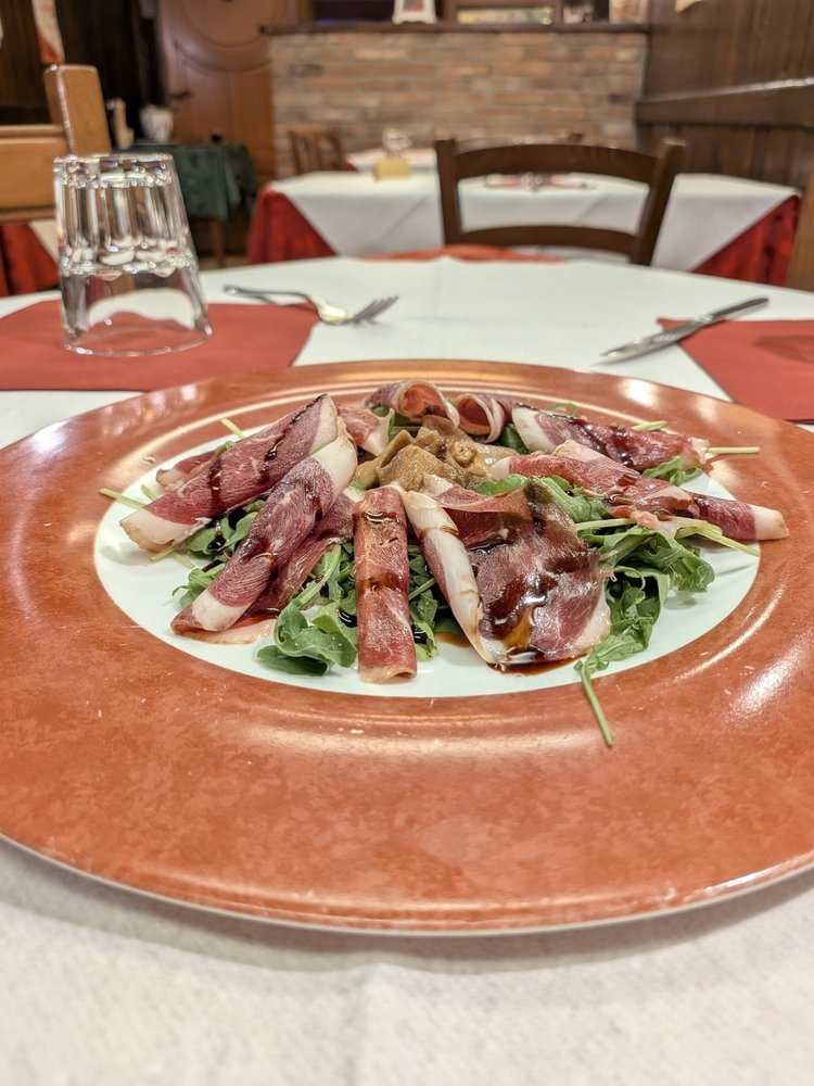 Carpaccio di petto d'oca affumicato ai profumi del bosco con porcini trifolati