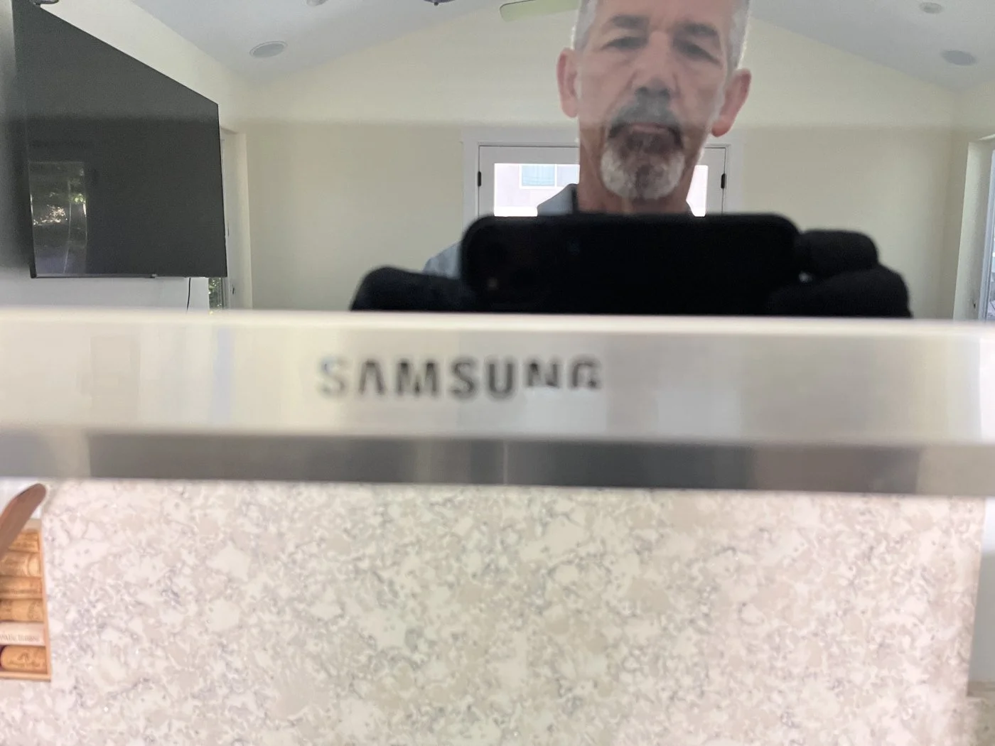 Reflection in a stainless steel range hood