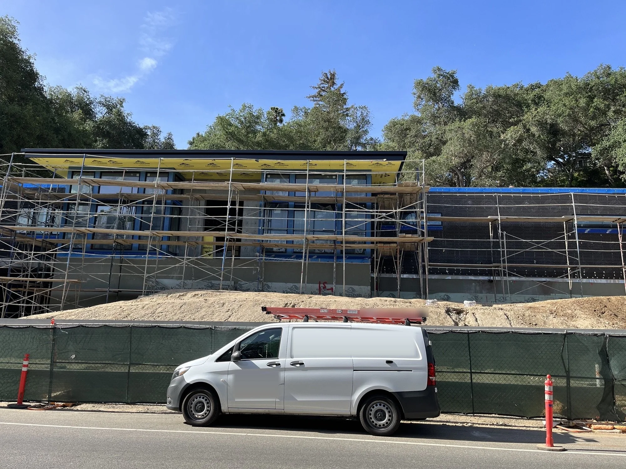 New home under construction, scaffolding and sheathing